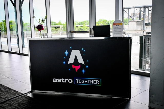 Black registration bar with the Astro Together logo across it in white, blue, and red.